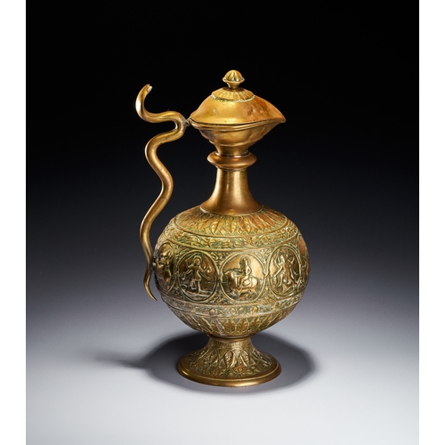 102 - A CHASED BRASS AFTABA EWER WITH SERPENT HANDLE AND HINDU DEITIES, SOUTH INDIA, 19TH CENTURY This Ind... 