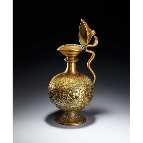 102 - A CHASED BRASS AFTABA EWER WITH SERPENT HANDLE AND HINDU DEITIES, SOUTH INDIA, 19TH CENTURY This Ind... 