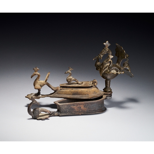 105 - A BRONZE PEACOCK KUMKUM TIKKA SPIRITUAL BOX, DECCAN INDIA, 17TH CENTURY This bronze ritual container... 