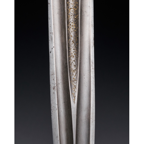 119 - AN INDIAN STEEL KATAR WITH GOLD INLAID, 18TH CENTURY This Indian katar, or punch dagger, is construc... 