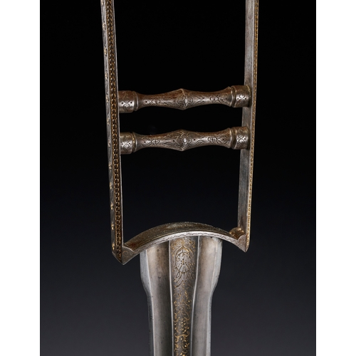 119 - AN INDIAN STEEL KATAR WITH GOLD INLAID, 18TH CENTURY This Indian katar, or punch dagger, is construc... 