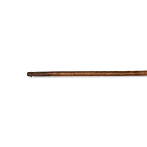 128 - A PALM GRIP WALKING CANE WITH CHERRY AMBER HANDLE AND HARDWOOD SHAFT This walking cane features a pa... 