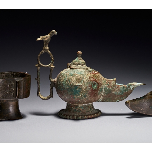 139 - A GROUP OF ISLAMIC BRONZE KHORASAN OIL LAMPS, IRAN, 12TH-13TH CENTURY The group includes various for... 