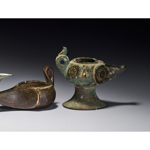 139 - A GROUP OF ISLAMIC BRONZE KHORASAN OIL LAMPS, IRAN, 12TH-13TH CENTURY The group includes various for... 