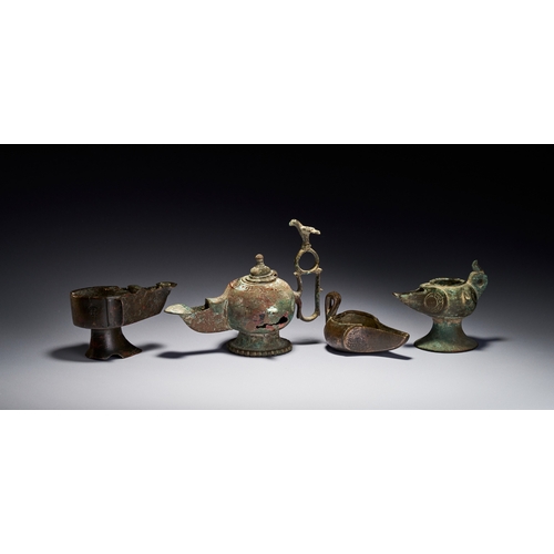 139 - A GROUP OF ISLAMIC BRONZE KHORASAN OIL LAMPS, IRAN, 12TH-13TH CENTURY The group includes various for... 