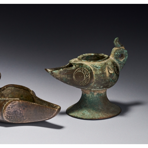 139 - A GROUP OF ISLAMIC BRONZE KHORASAN OIL LAMPS, IRAN, 12TH-13TH CENTURY The group includes various for... 