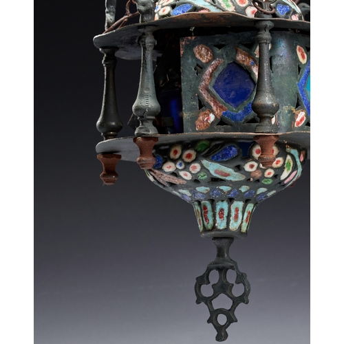 141 - AN ENAMELED AND PIERCED METAL HANGING MOSQUE LAMP, SYRIA, 19TH CENTURY This hanging mosque lamp is a... 