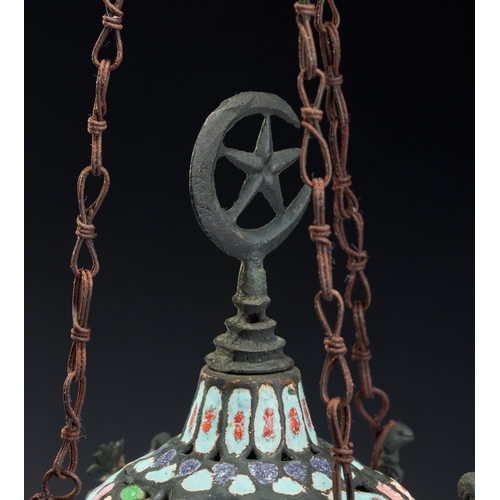 141 - AN ENAMELED AND PIERCED METAL HANGING MOSQUE LAMP, SYRIA, 19TH CENTURY This hanging mosque lamp is a... 