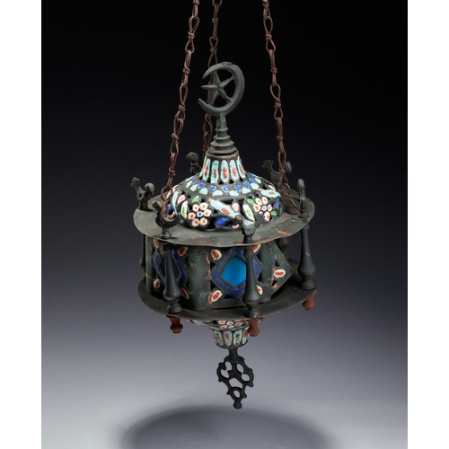 141 - AN ENAMELED AND PIERCED METAL HANGING MOSQUE LAMP, SYRIA, 19TH CENTURY This hanging mosque lamp is a... 
