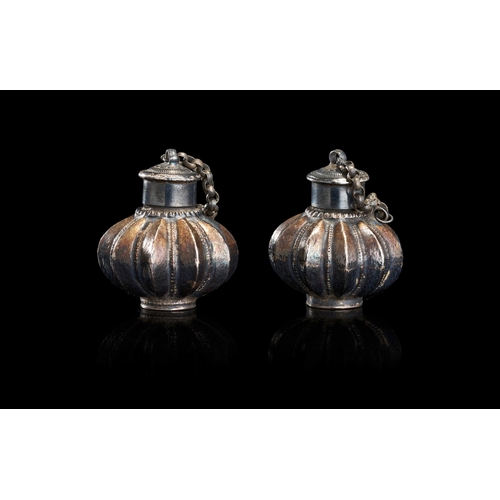 151 - A PAIR OF SILVER-TONED MELON-FORM SCENT BOTTLES, INDIA, 19TH CENTURY This pair of matching vessels i... 