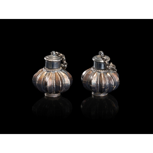 151 - A PAIR OF SILVER-TONED MELON-FORM SCENT BOTTLES, INDIA, 19TH CENTURY This pair of matching vessels i... 