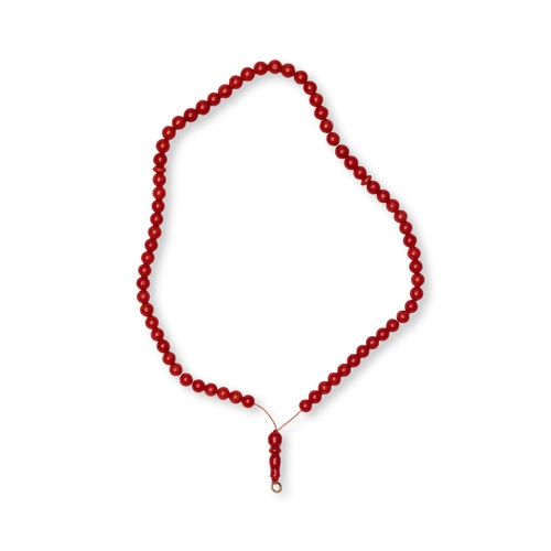 171 - A RED CORAL BEADED PRAYER STRAND (TASBIH) A red coral beaded strand configured as a set of prayer be... 