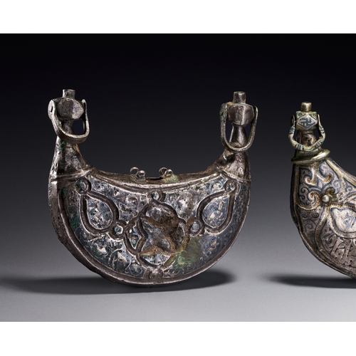 61 - A THREE SELJUK SILVER AND NIELLO PECTORAL AMULET CASES, IRAN, CIRCA 12TH CENTURY Comprising three cr... 