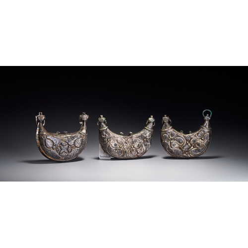 61 - A THREE SELJUK SILVER AND NIELLO PECTORAL AMULET CASES, IRAN, CIRCA 12TH CENTURY Comprising three cr... 