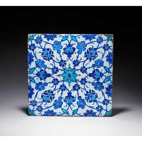 64 - AN IZNIK BLUE AND WHITE POTTERY TILE, TURKEY, 17TH CENTURY of square form, decorated in cobalt-blue,... 