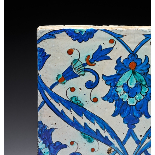 65 - AN IZNIK POTTERY TILE, OTTOMAN TURKEY, CIRCA 1580 The central composition features a large lobed pal... 