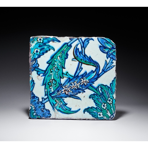 67 - A DAMASCUS POTTERY TILE WITH SAZ LEAF DESIGN, OTTOMAN SYRIA, 16TH - 17TH CENTURY The design is execu... 