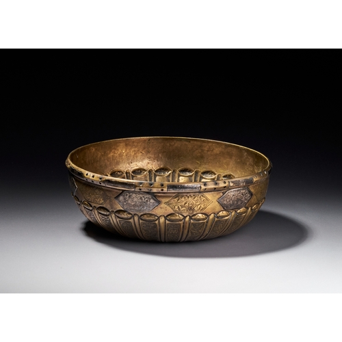 76 - A SILVER INLAID OTTOMAN HAMMAM BOWL, TURKEY, 18TH CENTURY This shallow brass bowl features a gadroon... 