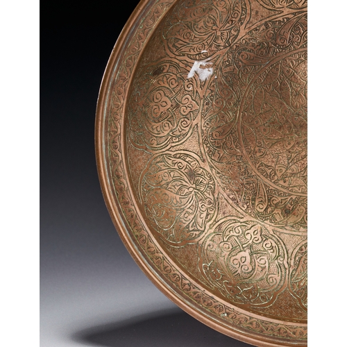 77 - A COPPER BOWL WITH FISH MOTIFS, DECCAN INDIA, 17TH - 18TH CENTURY The interior surface is densely de... 