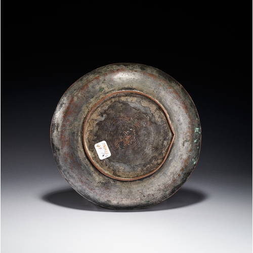 78 - AN ENGRAVED AND TINNED COPPER PLATE, KASHMIR INDIA, 19TH CENTURY This circular plate is constructed ... 