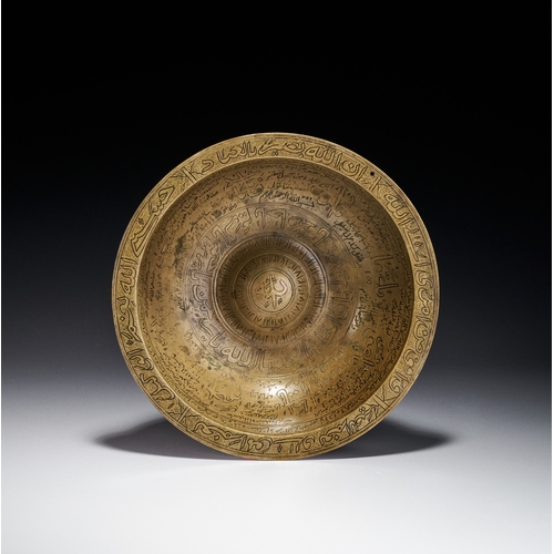 80 - AN ENGRAVED BRASS MAGIC BOWL, INDIA DECCAN, 18TH CENTURY This engraved brass magic bowl is a talisma... 