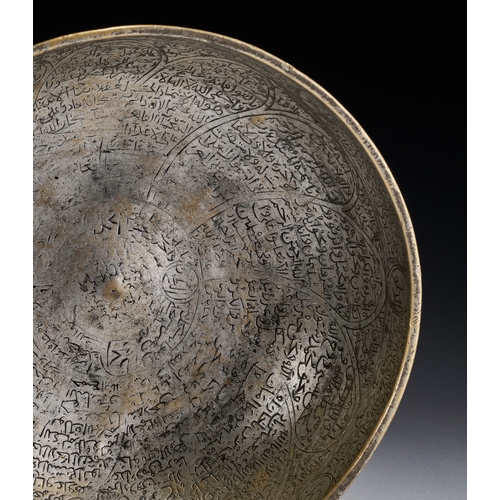 81 - A SAFAVID ENGRAVED COPPER MAGIC BOWL, PERSIA, 17TH - 18TH CENTURY This magic bowl is a hemispherical... 