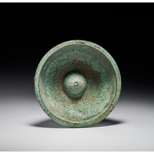 82 - A SAFAVID ENGRAVED BRONZE MAGIC BOWL, PERSIA, 17TH CENTURY The piece is decorated with extensive cha... 