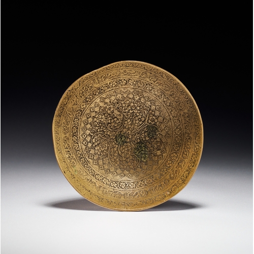 84 - A PERSIAN ZAND ENGRAVED BRASS DRINKING BOWL WITH CALLIGRAPHIC SCRIPT, 18TH CENTURY Features a plain,... 