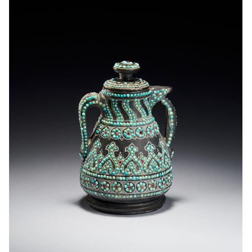 99 - A RARE QAJAR TURQUOISE INSET CARED STONE TEAPOT, PERSIA, 19TH CENTURY The vessel is carved from a da... 