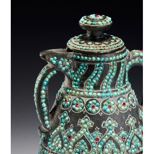 99 - A RARE QAJAR TURQUOISE INSET CARED STONE TEAPOT, PERSIA, 19TH CENTURY The vessel is carved from a da... 