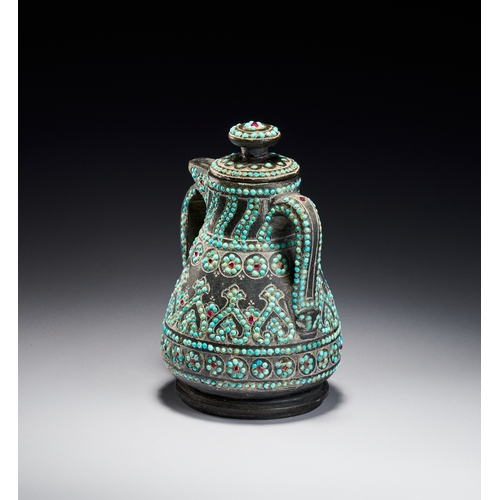 99 - A RARE QAJAR TURQUOISE INSET CARED STONE TEAPOT, PERSIA, 19TH CENTURY The vessel is carved from a da... 
