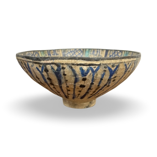 168 - A KASHAN UNDERGLAZE PAINTED POTTERY BOWL, PERSIA, EARLY 13TH CENTURY This footed conical bowl is att... 