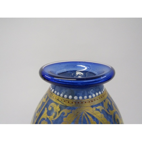 89 - VENETIAN GLASS, a fine gilded twin handled blue glass vase, decorated in Persian style, 8.5