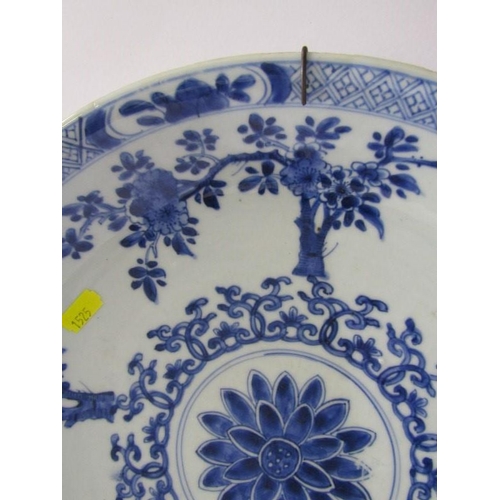 39 - ORIENTAL CERAMICS, Chinese underglaze blue saucer dish decorated with blossoming tree design and dou... 