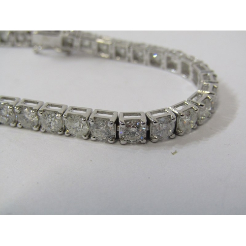388 - 18ct WHITE GOLD DIAMOND LINE BRACELET, approx 10.1ct of well matched brilliant cut diamonds of good ... 