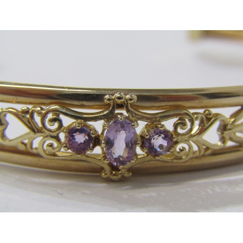 120 - 9ct YELLOW GOLD TORQUE STYLE BRACELET, set with 3 amethyst stones, approx 6.9 grams