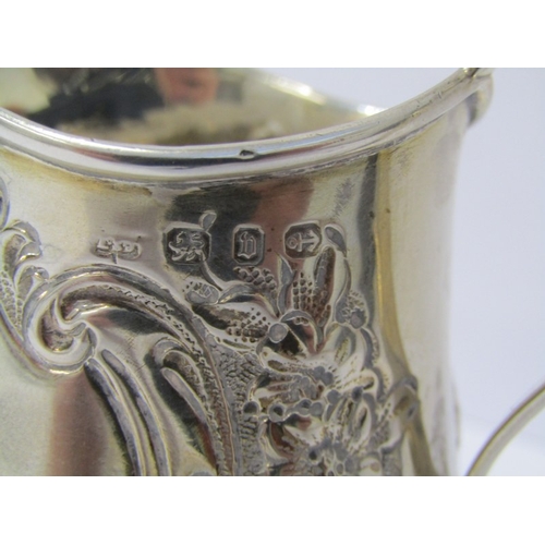 19 - VICTORIAN SILVER CREAM JUG, oval base with foliate and floral embossed decoration, Birmingham 1876, ... 