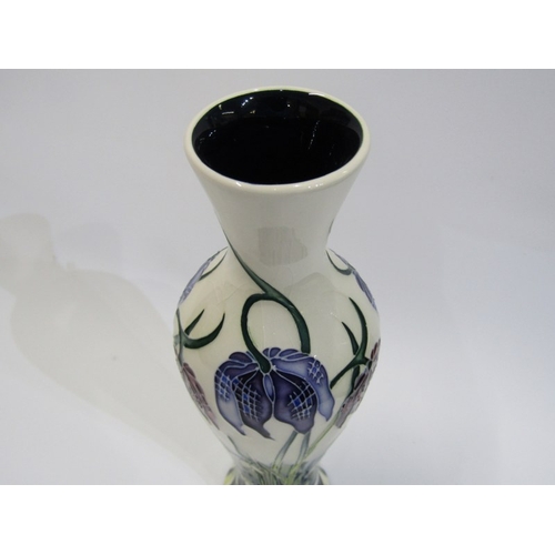 618 - MOORCROFT, modern Moorcroft 20 cms limited edition baluster form vase decorated bull rushes on a whi... 