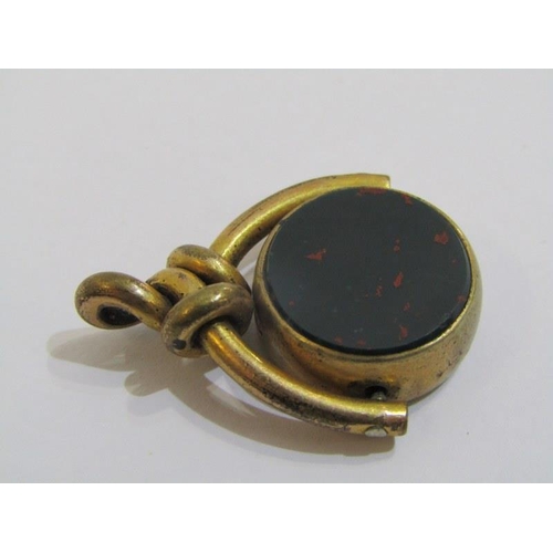 532 - SPINNING WATCH FOB, yellow metal spinning watch fob set carnelian