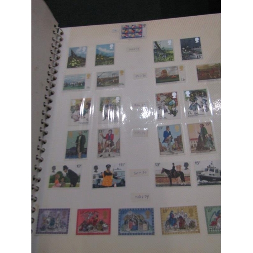 121 - MODERN MINT GB COLLECTION in 2 albums. Stamps held in by cling film and most stamps are stuck/partia... 