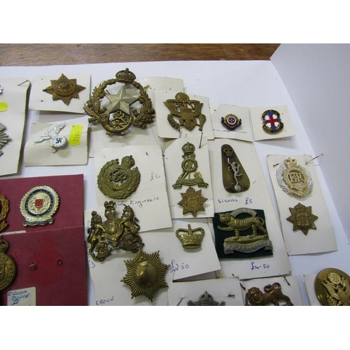 447 - CAP BADGES, a large box of assorted cap badges both English & Foreign including The Royal Scots, She... 