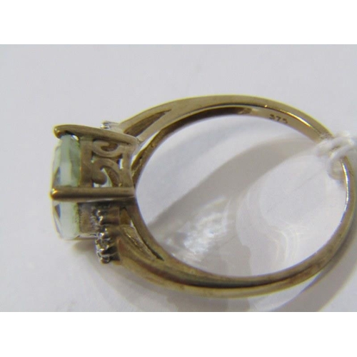 520 - 9ct YELLOW GOLD BLUE GREEN STONE RING, possibly aquamarine with diamond shoulders, size P