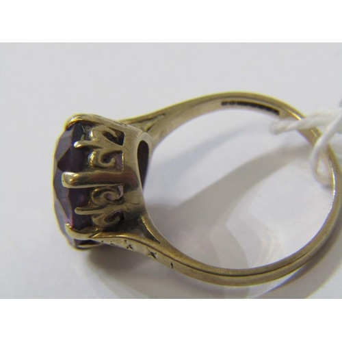 528 - 9ct YELLOW GOLD AMETHYST SOLITAIRE RING, large oval cut amethyst in multi claw setting, size M