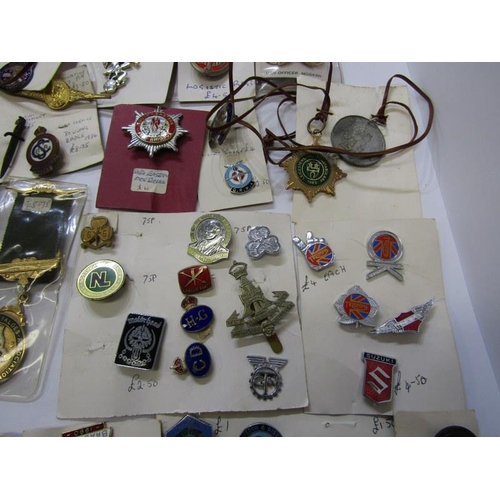 589 - CAP BADGES ETC. 2 boxes including cap badges, enamel badges etc. including Conduct of Triumph badges... 