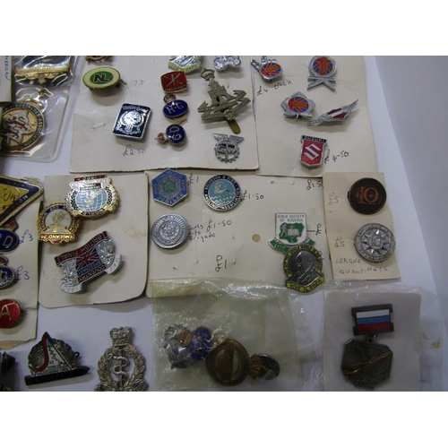 589 - CAP BADGES ETC. 2 boxes including cap badges, enamel badges etc. including Conduct of Triumph badges... 