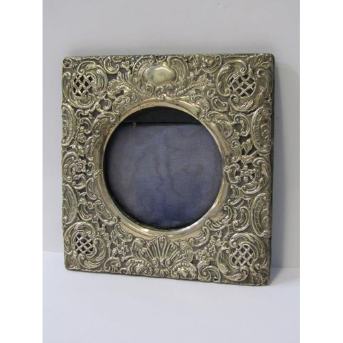 10 - EDWARDIAN SILVER PHOTO FRAME, ornate scroll and floral embossed square frame with circular reserve, ... 