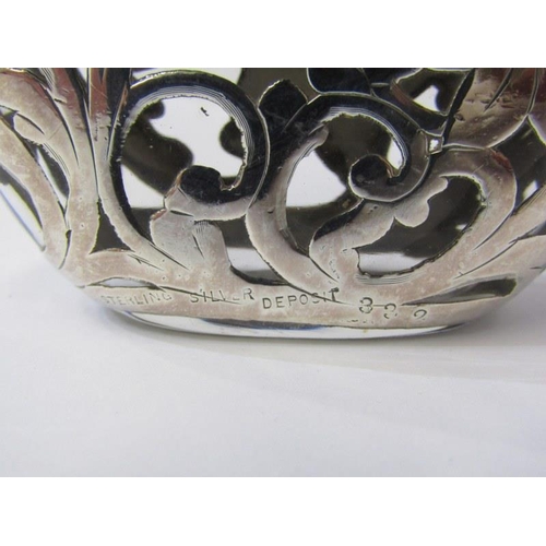 11 - STERLING SILVER CASED GLASS HIP FLASK, with ornate scroll and floral design, 10cm height