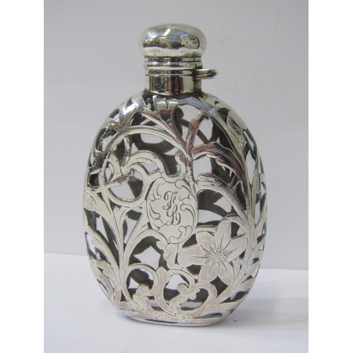 11 - STERLING SILVER CASED GLASS HIP FLASK, with ornate scroll and floral design, 10cm height