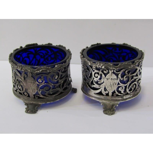 35 - PAIR OF GEORGIAN DESIGN SILVER CIRCULAR SALTS, ornate fretwork design with blue glass liners, 97 gra... 