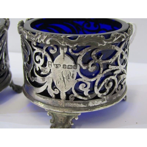 35 - PAIR OF GEORGIAN DESIGN SILVER CIRCULAR SALTS, ornate fretwork design with blue glass liners, 97 gra... 